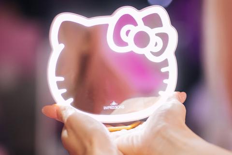 7283-hello-kitty-x-impressions-vanity-pocket-mirror-with-ring-stand-1.jpg